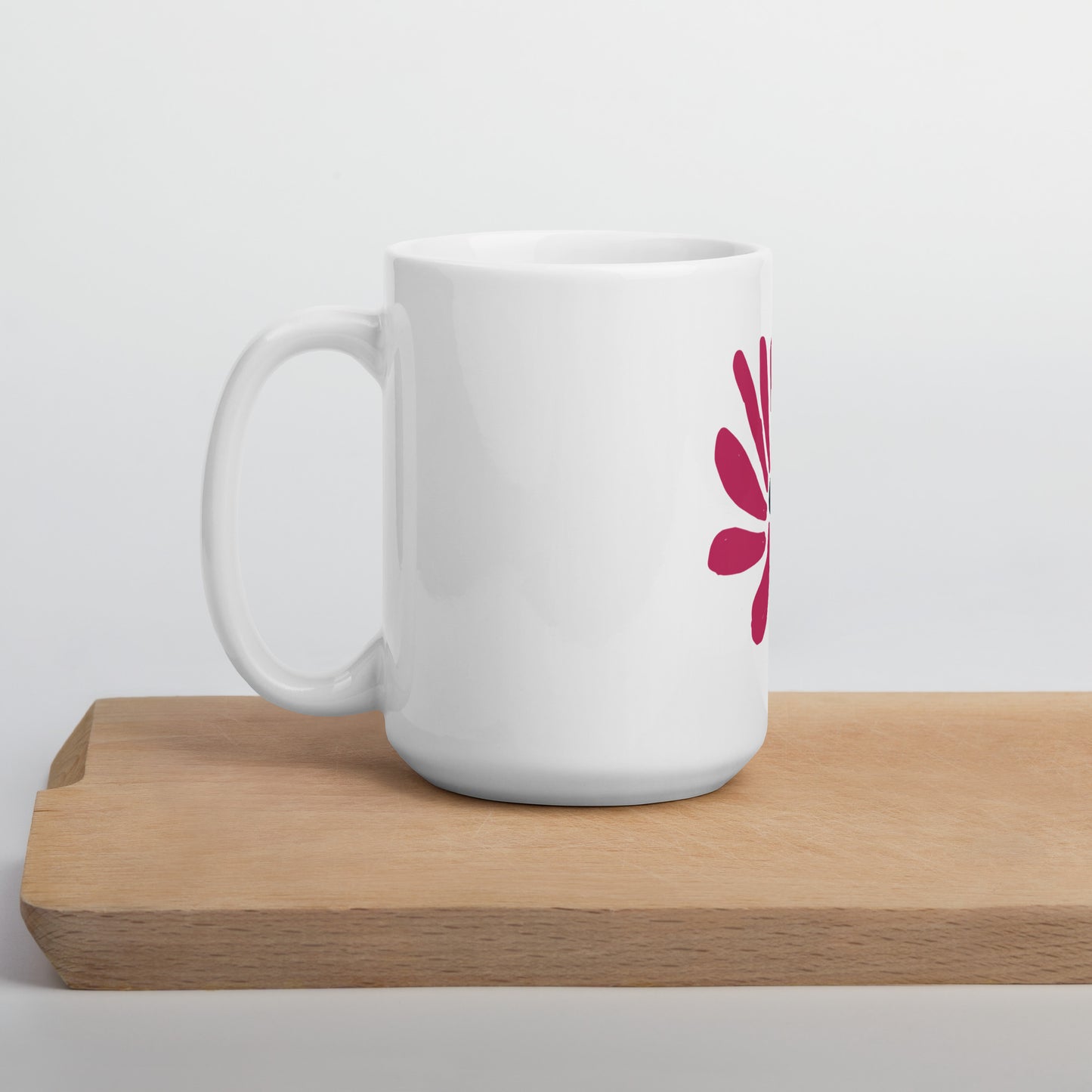 White glossy mug depicting abstract flower
